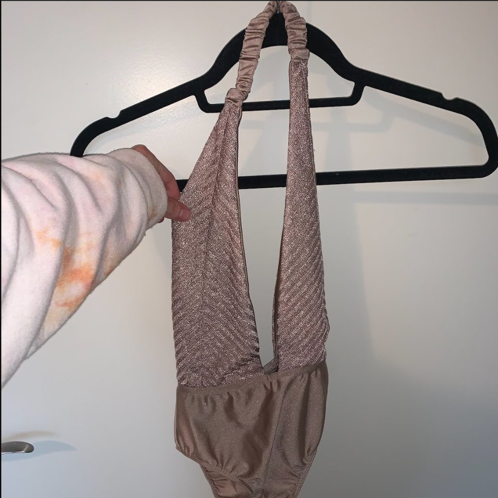 Urban Outfitters plunging sparkly body suit